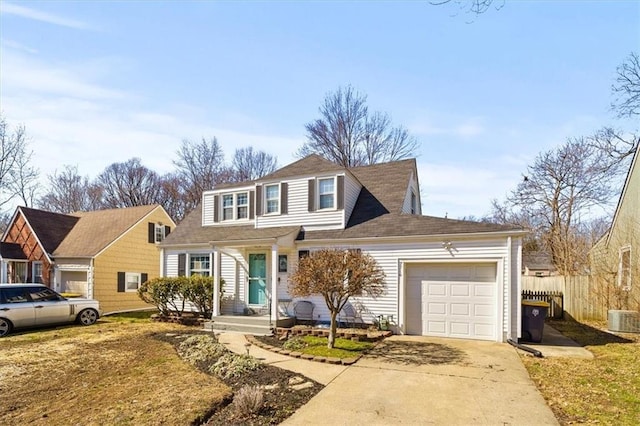 traditional home with a garage, central air condition unit, driveway, and fence