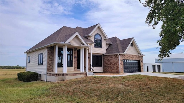 view of front of property featuring driveway, roof with shingles, a front lawn, a garage, and brick siding