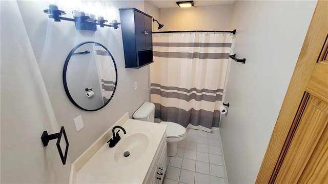 bathroom featuring tile patterned floors, a shower with shower curtain, toilet, and vanity