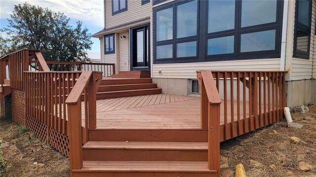 wooden deck featuring entry steps