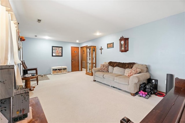 carpeted living room featuring recessed lighting and visible vents