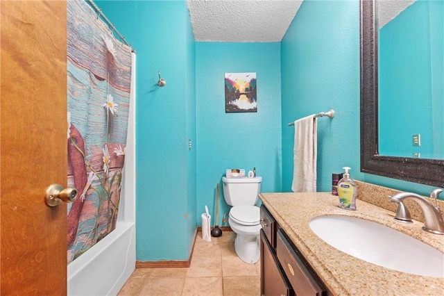 bathroom featuring vanity, baseboards, tile patterned flooring, a textured ceiling, and toilet