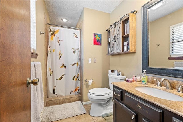 bathroom with tile patterned floors, toilet, a textured ceiling, a shower with shower curtain, and vanity