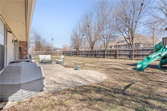 view of yard featuring a patio area, a playground, a fenced backyard, and an outdoor hangout area