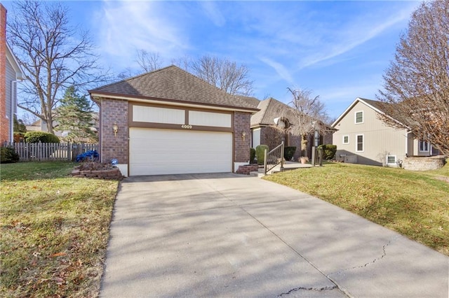 view of front of property with a front yard, fence, a garage, and driveway