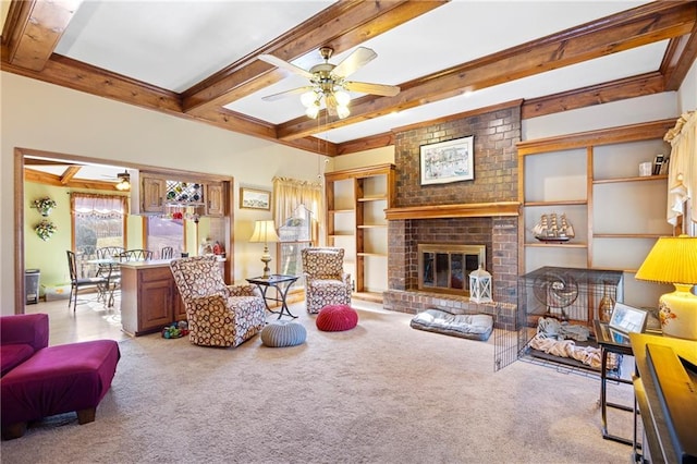 living room with beamed ceiling, ceiling fan, and carpet floors