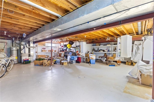 basement featuring heating unit and gas water heater