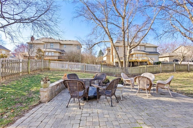 view of patio with a residential view and a fenced backyard