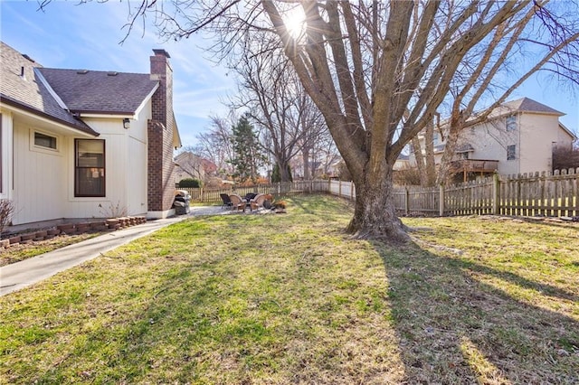 view of yard with a patio and a fenced backyard