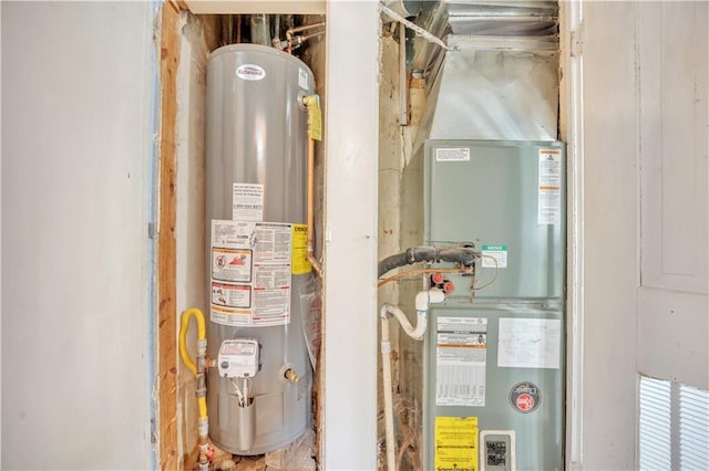 utility room featuring water heater