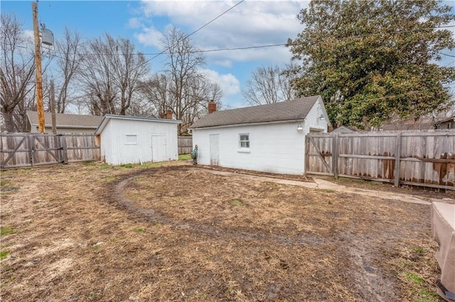 exterior space featuring an outbuilding and a fenced backyard