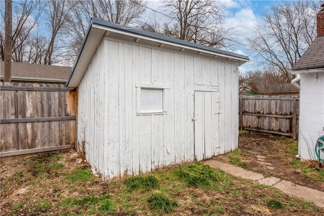 view of shed with a fenced backyard