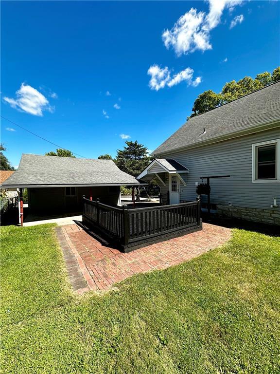 view of yard with a patio area and a wooden deck