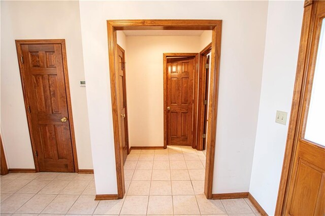 22513 E 33rd St S, Blue Springs, MO 64015 - hall featuring light tile patterned floors and baseboards