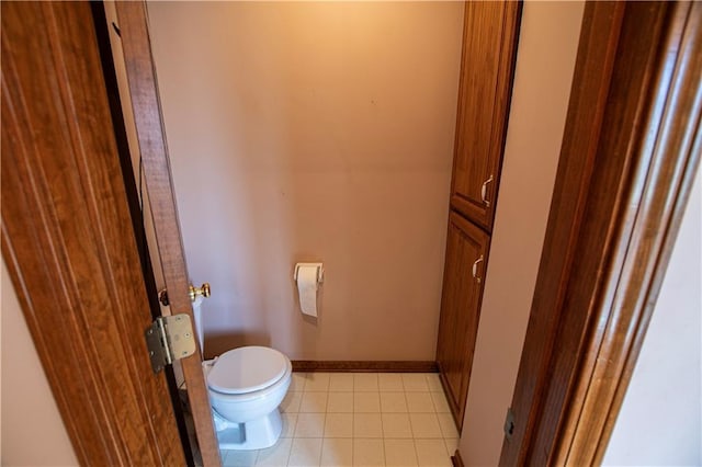 22513 E 33rd St S, Blue Springs, MO 64015 - bathroom with baseboards, toilet, and tile patterned flooring