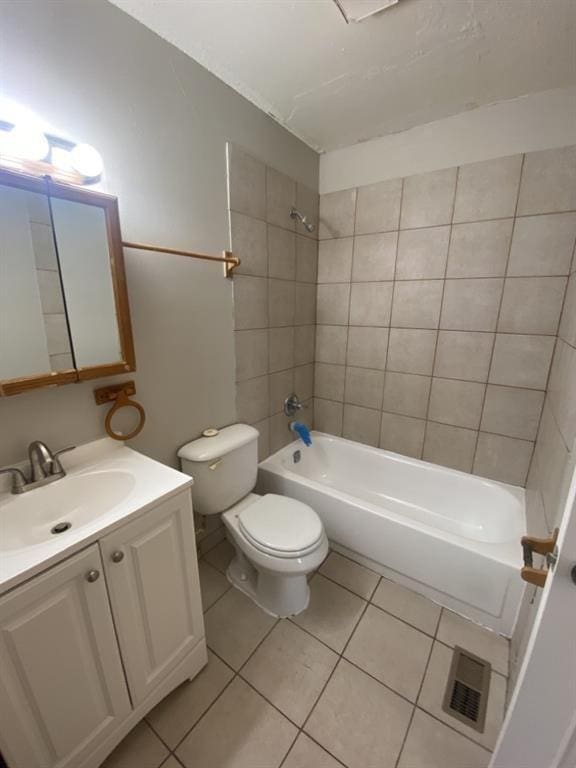 bathroom with vanity, visible vents,  shower combination, tile patterned flooring, and toilet