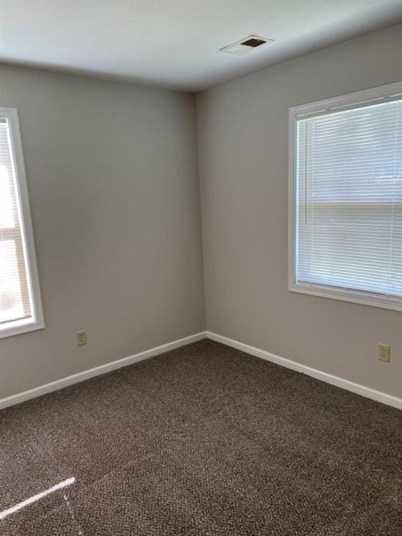 18822 E Wigwam Dr, Independence, MO 64056 - spare room with visible vents, baseboards, and carpet flooring