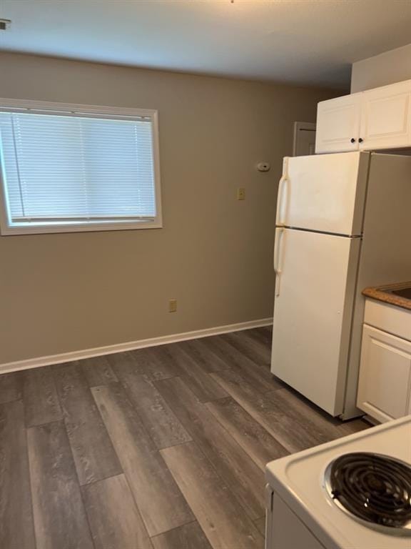 18822 E Wigwam Dr, Independence, MO 64056 - kitchen with white cabinetry, white appliances, baseboards, and dark wood-style flooring