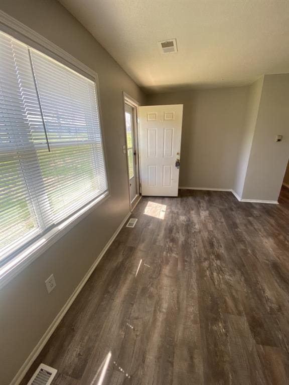 18822 E Wigwam Dr, Independence, MO 64056 - foyer entrance with dark wood-type flooring, baseboards, and visible vents