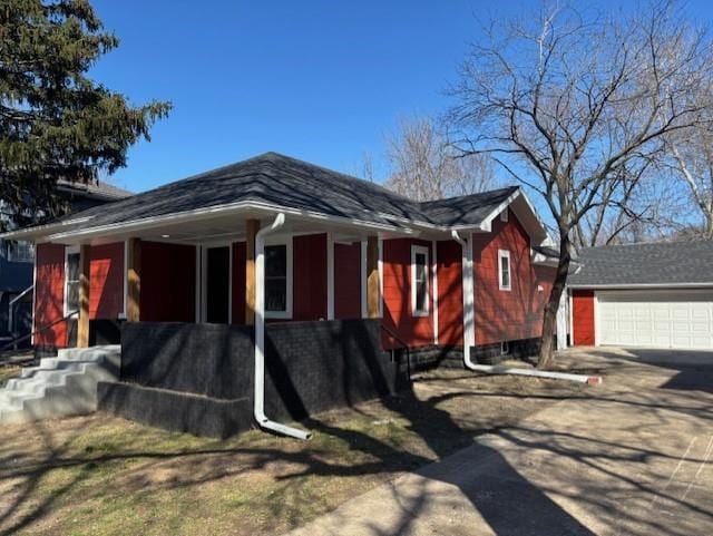 view of home's exterior with concrete driveway and a garage