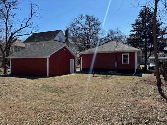 view of home's exterior featuring an outbuilding and a yard