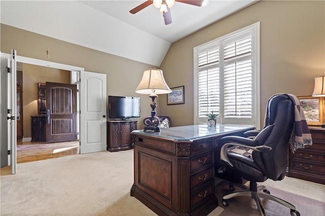 office with light carpet, lofted ceiling, and a ceiling fan