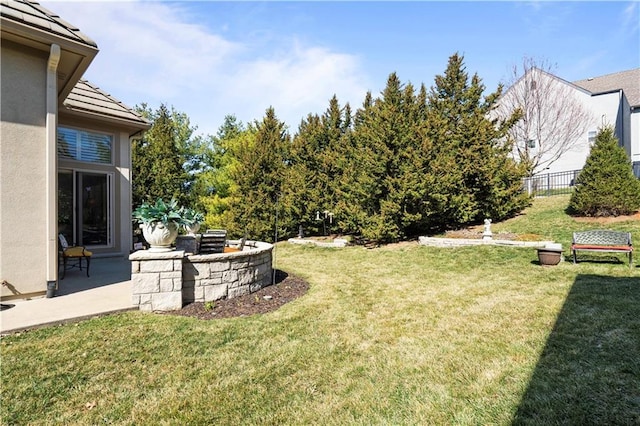 view of yard with a patio area and fence