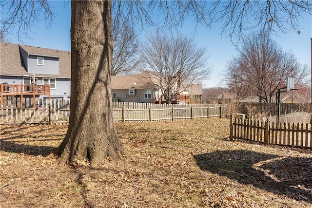 view of yard with a residential view and a fenced backyard