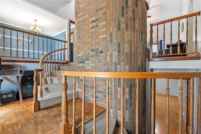 stairs featuring a chandelier