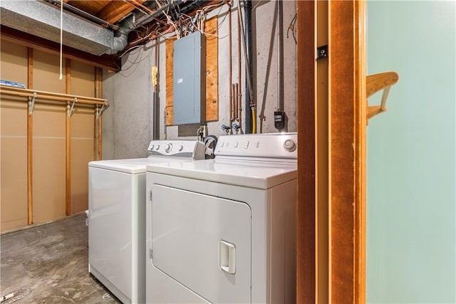 washroom with electric panel, laundry area, and separate washer and dryer