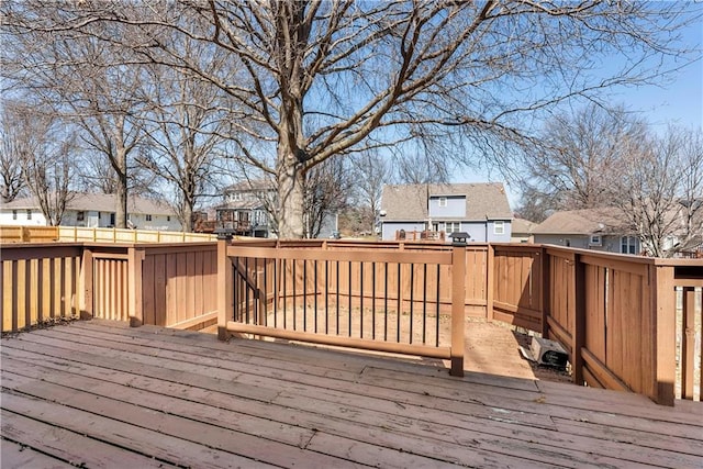 wooden deck featuring fence and a residential view