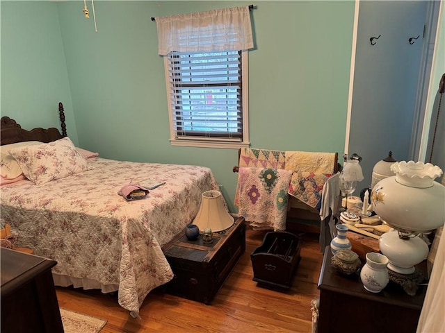 bedroom with wood finished floors