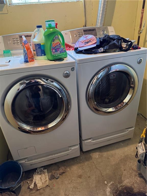 laundry area featuring independent washer and dryer and laundry area