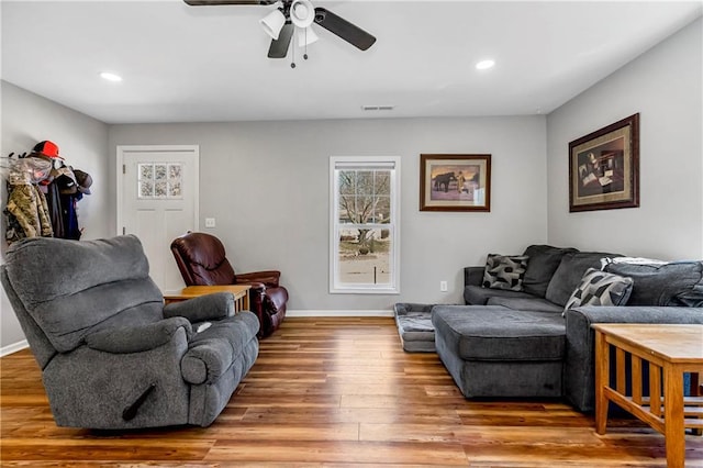 living area with visible vents, a ceiling fan, wood finished floors, recessed lighting, and baseboards