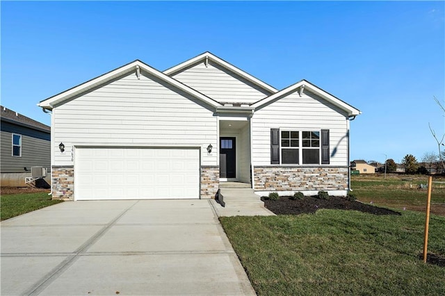 craftsman inspired home featuring central air condition unit, stone siding, a front yard, concrete driveway, and an attached garage