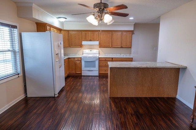 kitchen with under cabinet range hood, dark wood finished floors, white appliances, and light countertops