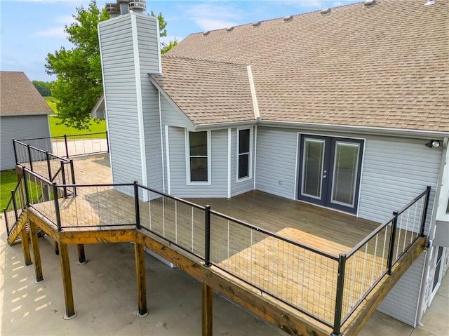 1796 NW 770th Rd, Bates City, MO 64011 - back of property with roof with shingles, a chimney, french doors, and a wooden deck