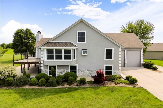 1796 NW 770th Rd, Bates City, MO 64011 - back of property featuring concrete driveway, stucco siding, roof with shingles, stone siding, and a yard