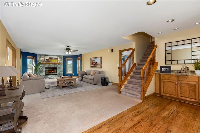 1796 NW 770th Rd, Bates City, MO 64011 - living area with ceiling fan, a stone fireplace, stairway, plenty of natural light, and recessed lighting