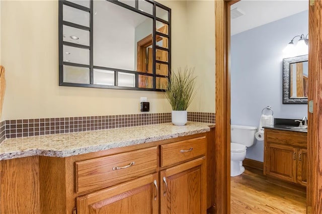 1796 NW 770th Rd, Bates City, MO 64011 - bathroom with vanity, toilet, and wood finished floors
