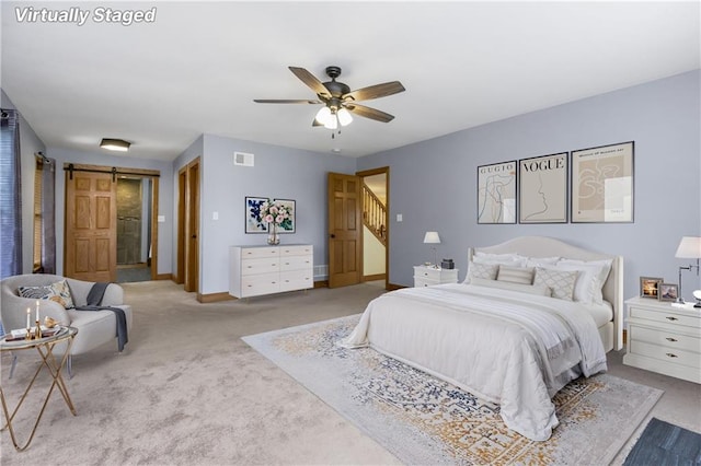 1796 NW 770th Rd, Bates City, MO 64011 - bedroom with carpet flooring, a barn door, baseboards, and ceiling fan