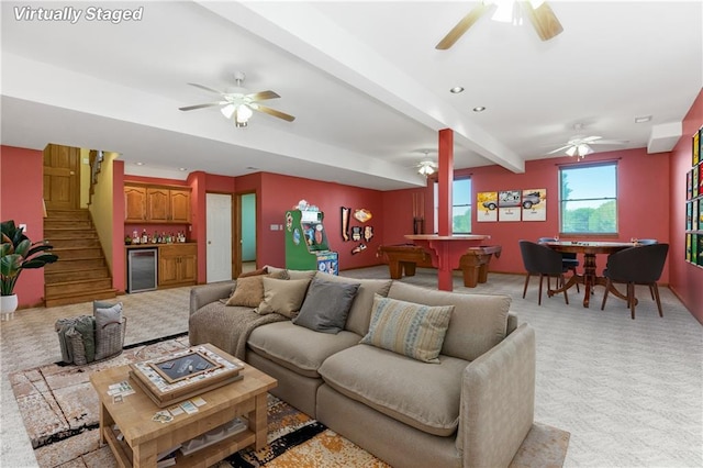 1796 NW 770th Rd, Bates City, MO 64011 - living room with a ceiling fan, light carpet, beamed ceiling, stairway, and beverage cooler
