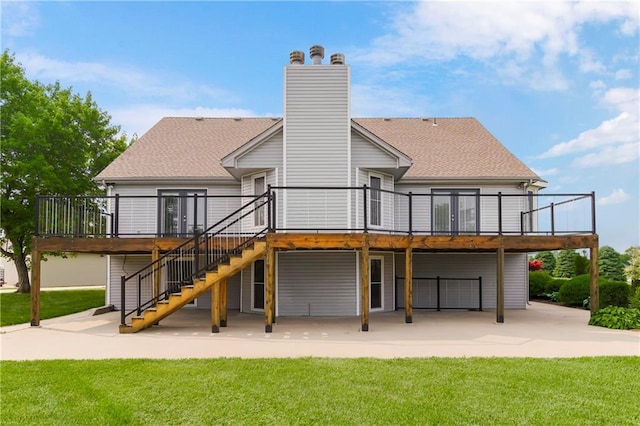 1796 NW 770th Rd, Bates City, MO 64011 - back of property featuring a patio, a deck, stairway, and a shingled roof