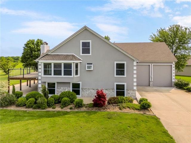 1796 NW 770th Rd, Bates City, MO 64011 - view of front of home featuring stone siding, concrete driveway, a garage, and stucco siding