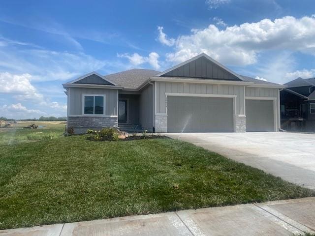 20814 W 188th St, Spring Hill, KS 66083 - ranch-style house with board and batten siding, stone siding, an attached garage, a front lawn, and concrete driveway