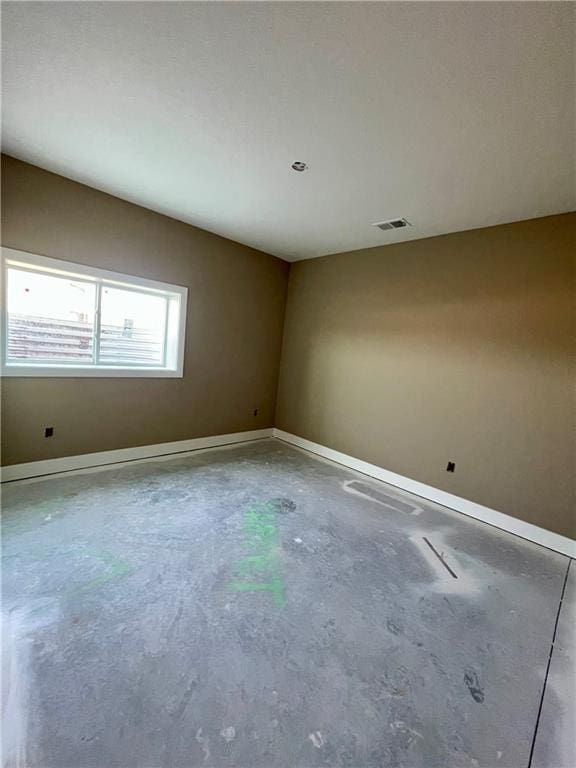 1302 NE 122nd St, Kansas City, MO 64165 - spare room featuring unfinished concrete floors and baseboards