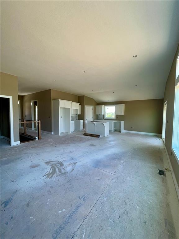 1302 NE 122nd St, Kansas City, MO 64165 - unfurnished living room with baseboards