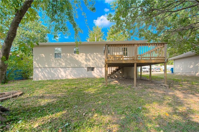 back of property featuring crawl space, a yard, stairs, and a deck