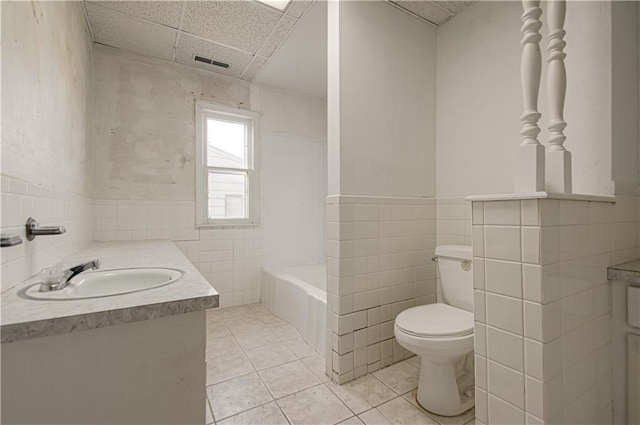 full bathroom with tile patterned flooring, visible vents, toilet, and vanity