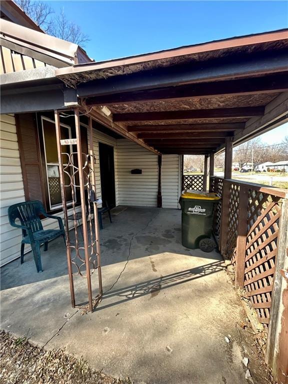 view of patio / terrace with an attached carport